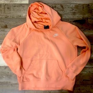 Women’s NIKE light pink hooded sweatshirt size medium.